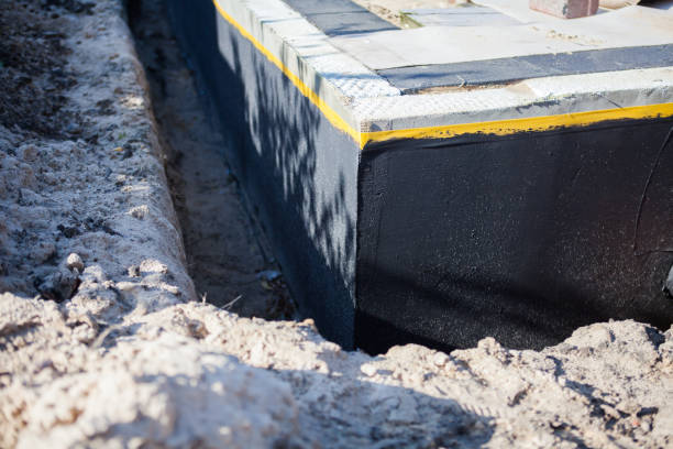 Professional Waterproofing technician working in Milan, IN